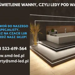 Nowoczesna łazienka z wanną i dyskretnym podświetleniem LED.