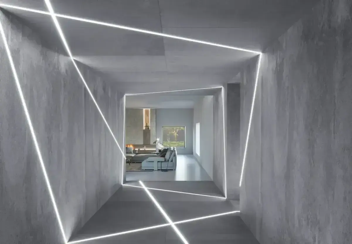 Nowoczesny korytarz z betonowymi ścianami, gdzie linie LED tworzą geometryczne wzory. Inspiracja, jak zamontować oświetlenie LED w witrynie, by nadać jej futurystyczny wygląd.